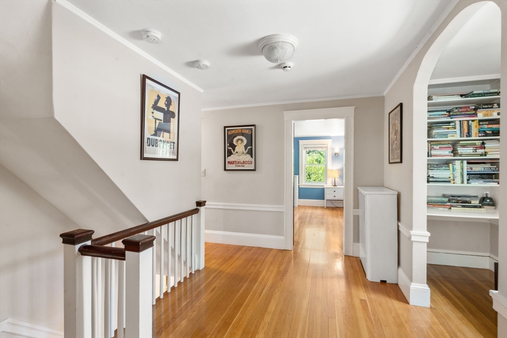 513 Chestnut Street Newton, MA 02468 - Photo 14 of 32 a view of a hallway with wooden floor and windows