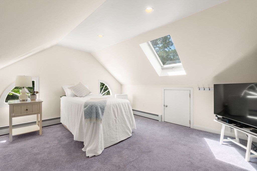 513 Chestnut Street Newton, MA 02468 - Photo 20 of 32 a living room with furniture and a flat screen tv