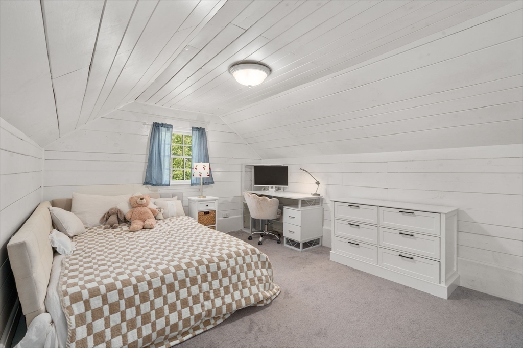 513 Chestnut Street Newton, MA 02468 - Photo 21 of 32 a bedroom with a bed and a chair