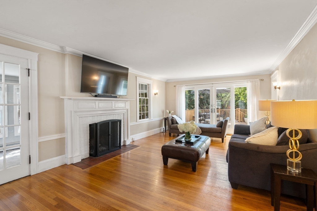 513 Chestnut Street Newton, MA 02468 - Photo 5 of 32 a living room with furniture a fireplace and a flat screen tv
