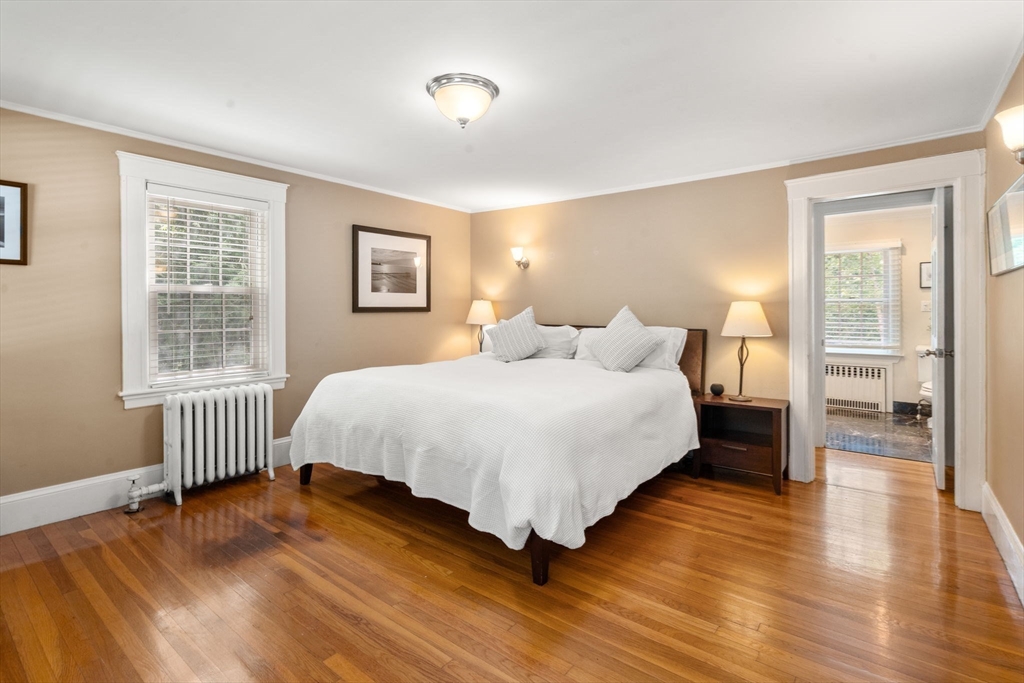 513 Chestnut Street Newton, MA 02468 - Photo 10 of 32 a bedroom with a bed and wooden floor