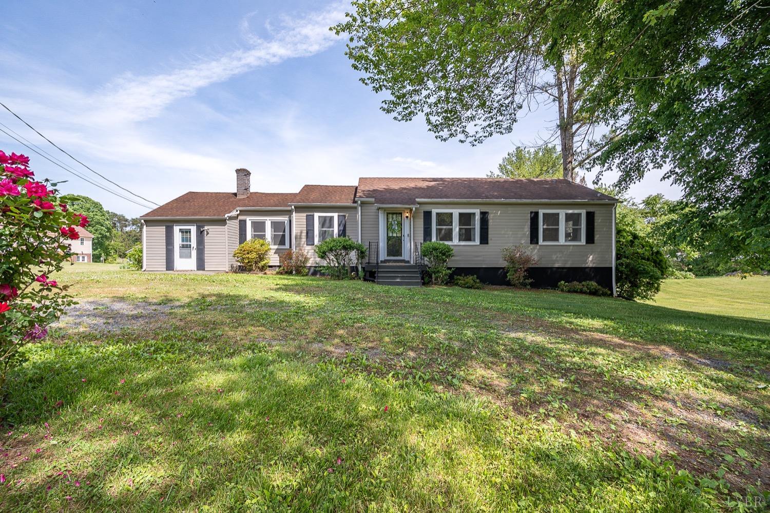 4794 Salem Road Spout Spring, VA 24593 - Photo 1 of 34 a front view of a house with garden