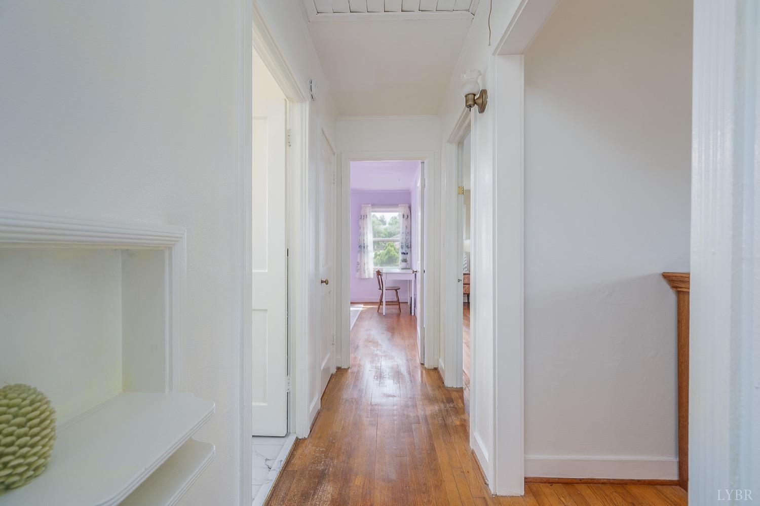 4794 Salem Road Spout Spring, VA 24593 - Photo 11 of 34 a view of a hallway with wooden floor