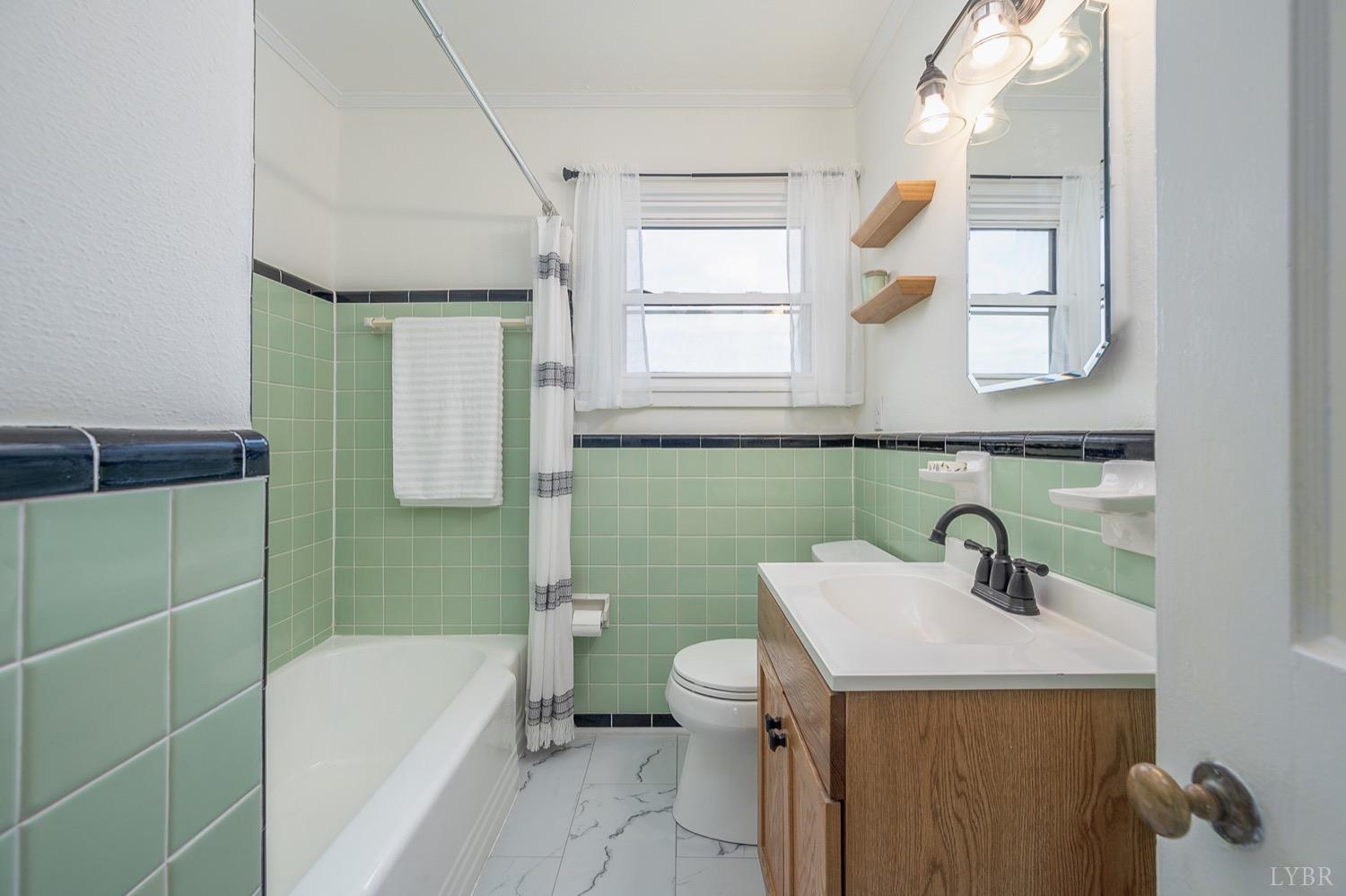 4794 Salem Road Spout Spring, VA 24593 - Photo 12 of 34 a bathroom with a sink toilet and shower