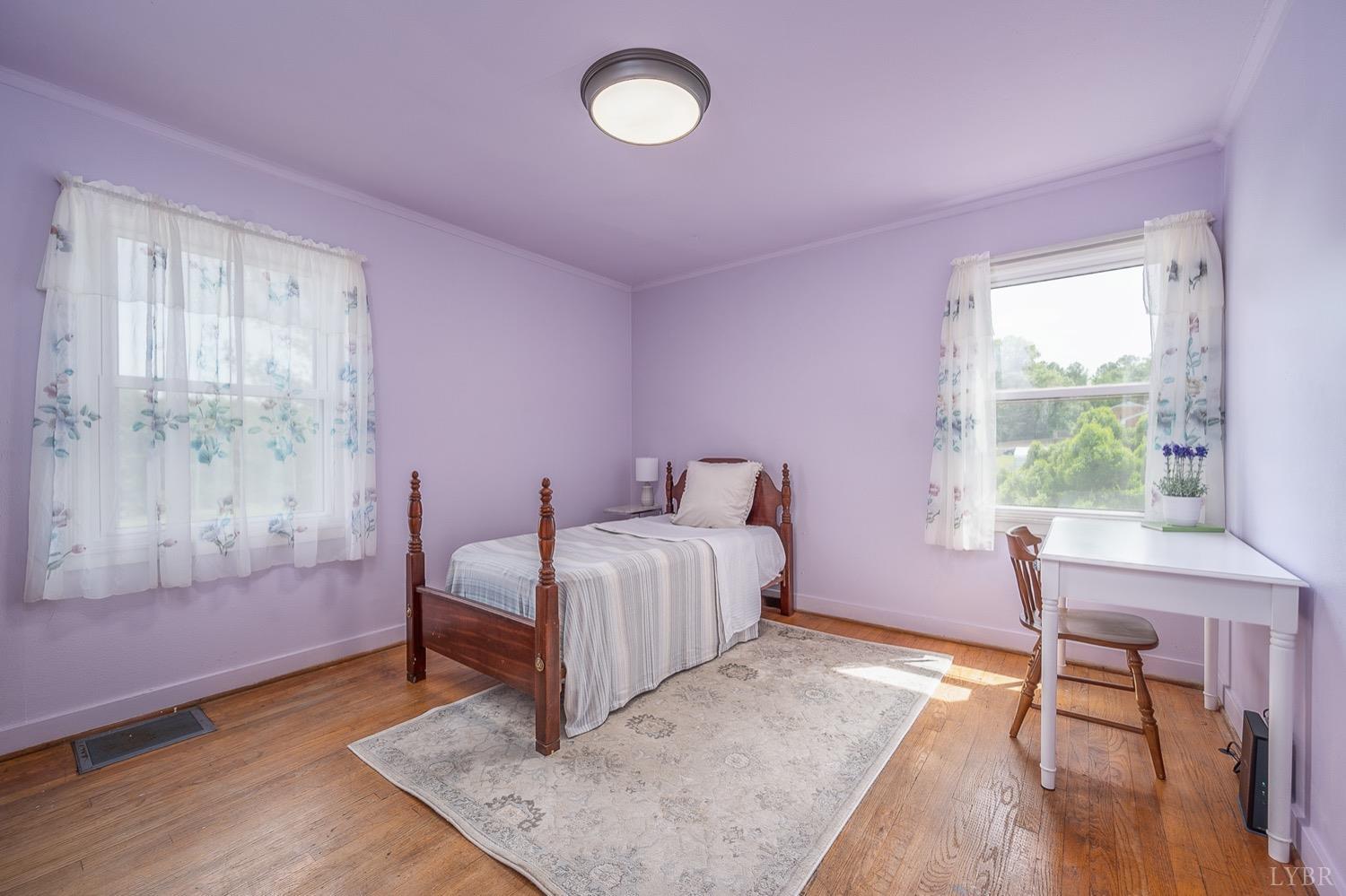4794 Salem Road Spout Spring, VA 24593 - Photo 13 of 34 a bedroom with a bed and a table
