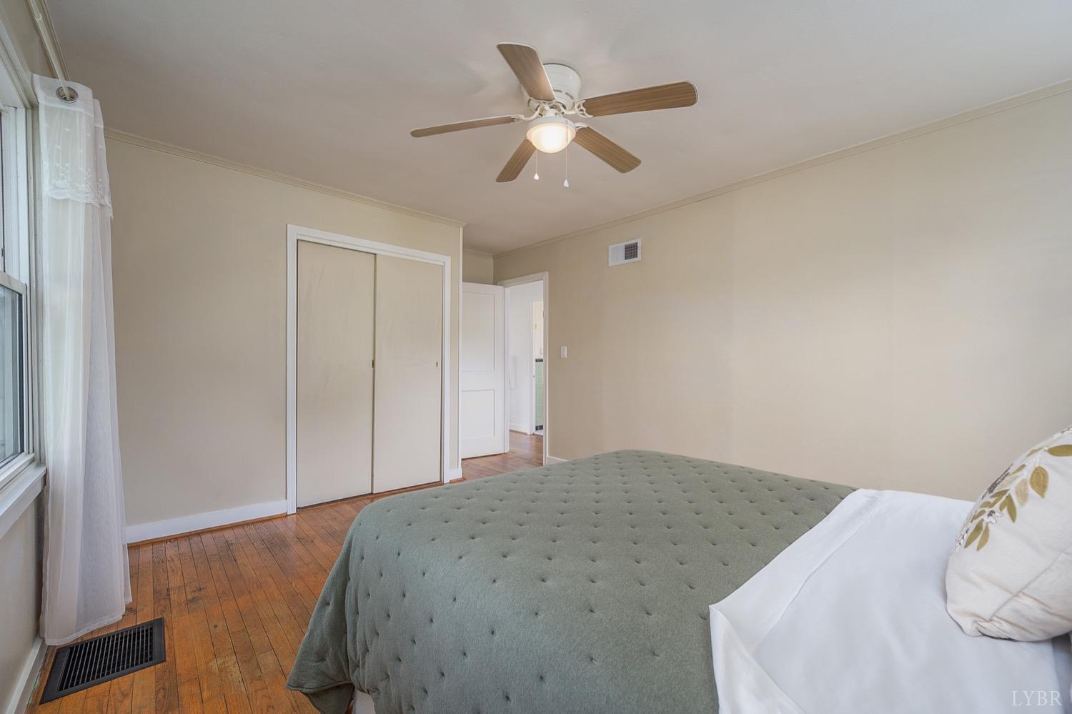 4794 Salem Road Spout Spring, VA 24593 - Photo 16 of 34 a bedroom with a bed and a ceiling fan