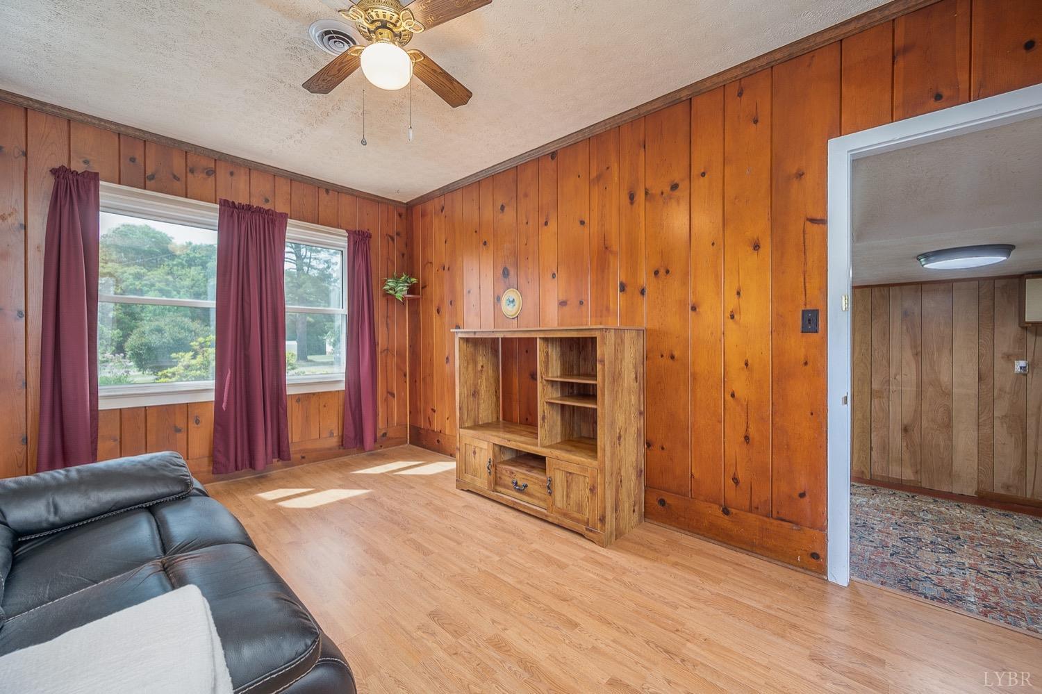 4794 Salem Road Spout Spring, VA 24593 - Photo 20 of 34 a living room with furniture and a fireplace