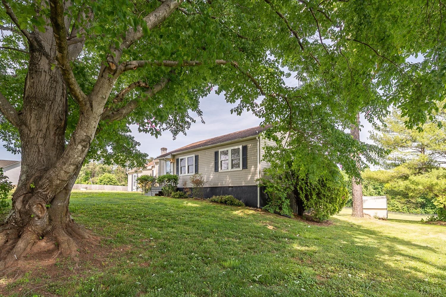4794 Salem Road Spout Spring, VA 24593 - Photo 34 of 34 a view of a house with yard and tree s