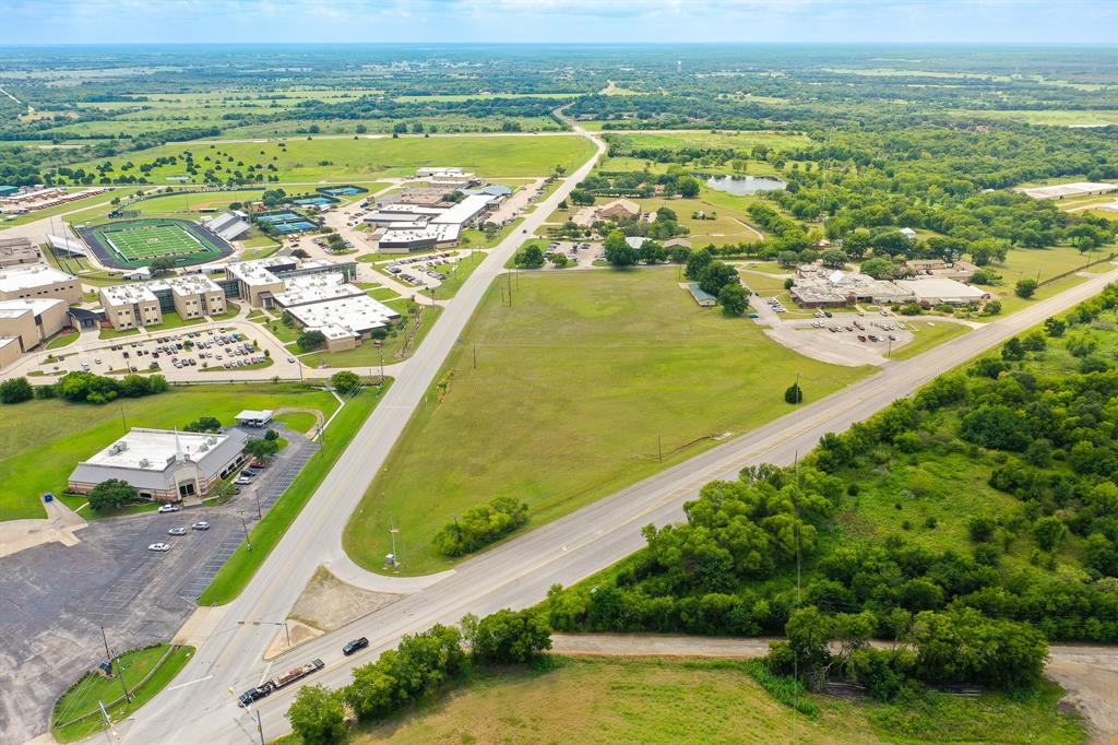 0 South Washington Street, Unit E Kaufman, TX 75142 - Photo 4 of 6 an aerial view of residential houses with outdoor space
