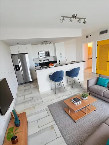 a living room with furniture and a rug