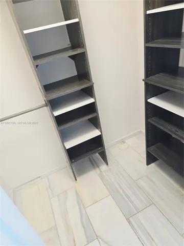 a view of a house with a sink and wooden floor