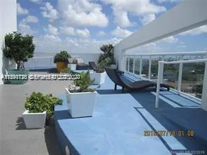 a view of a swimming pool with a lounge chair