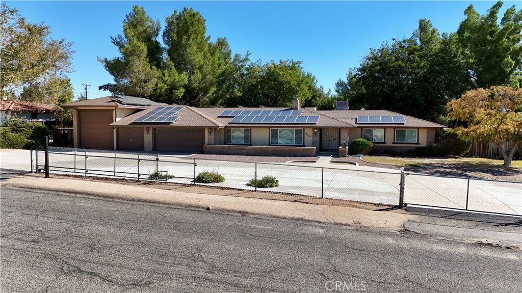14705 Mandan Road Apple Valley, CA 92307 - Photo 3 of 20 a front view of a house with street
