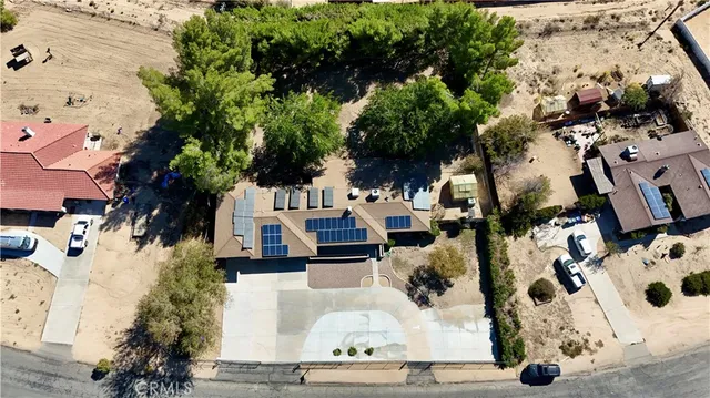an aerial view of multiple houses with yard