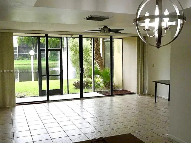 a view of an entryway with a floor to ceiling window