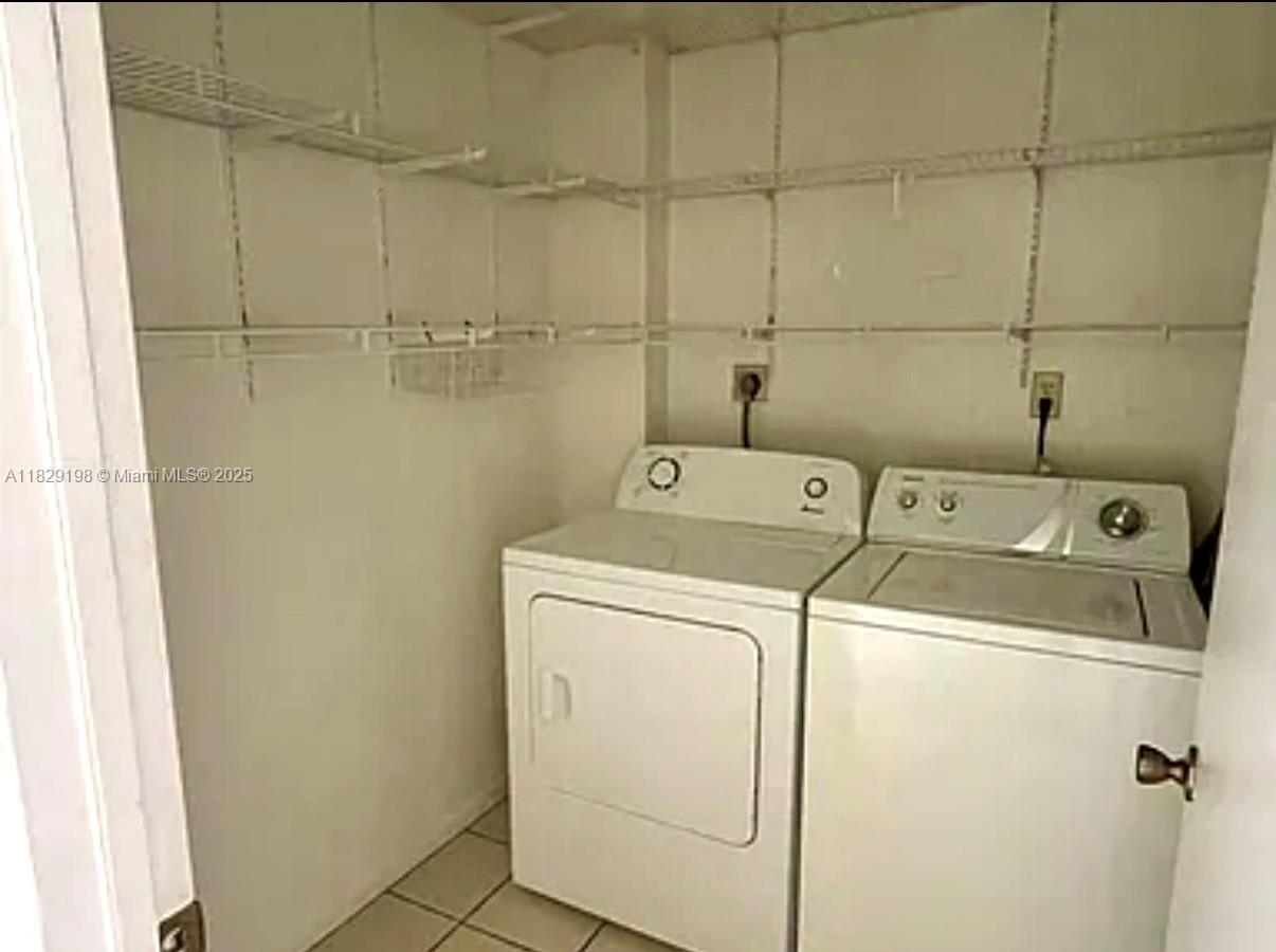 2941 Southwest 87th Avenue, Unit 406 Davie, FL 33328 - Photo 11 of 16 a utility room with dryer and washer