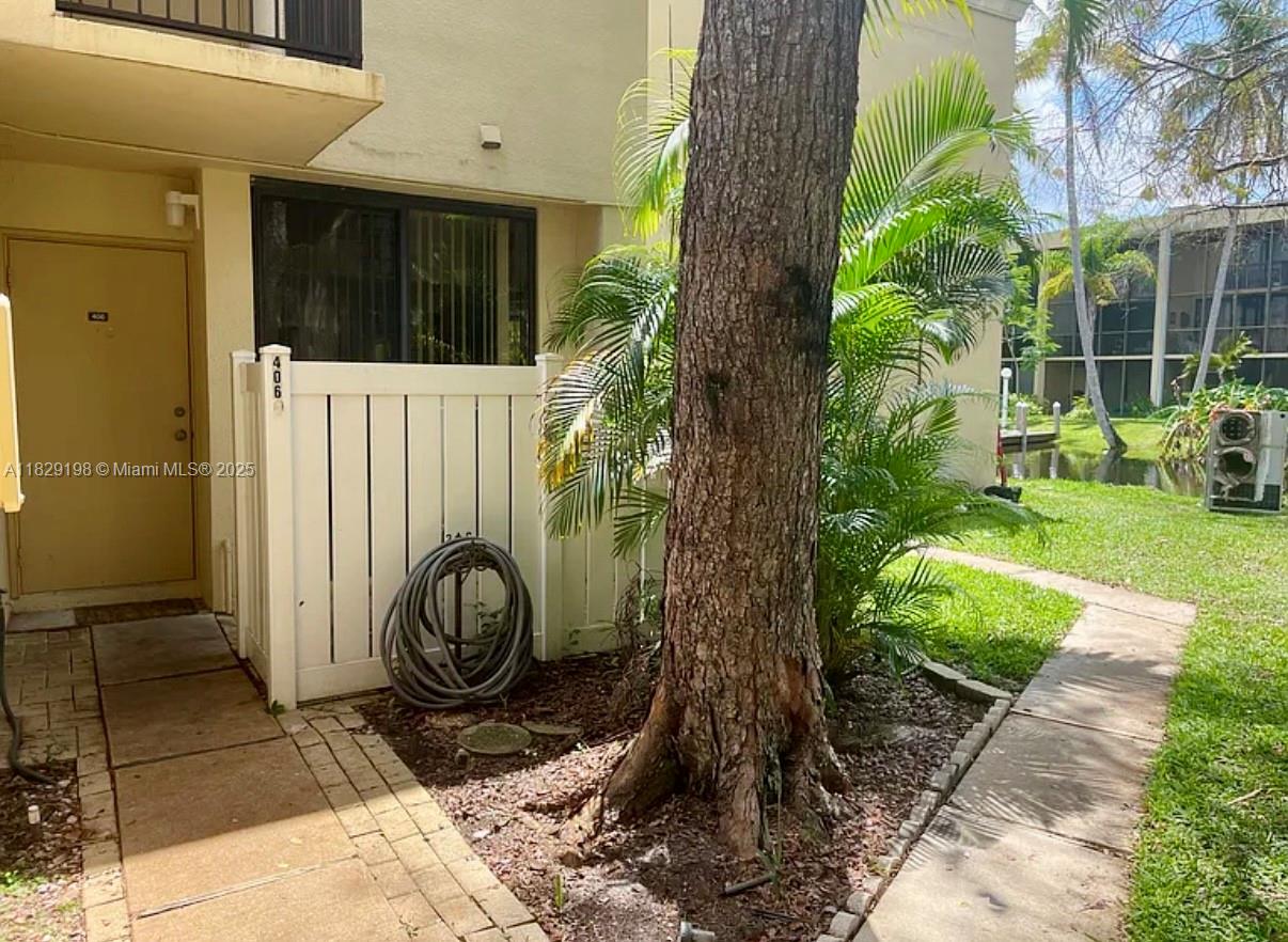 2941 Southwest 87th Avenue, Unit 406 Davie, FL 33328 - Photo 12 of 16 a bathroom with a toilet a sink and garden