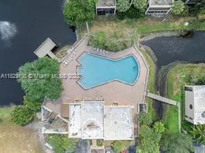 an aerial view of a house with outdoor space