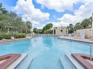 a view of a backyard with sitting area