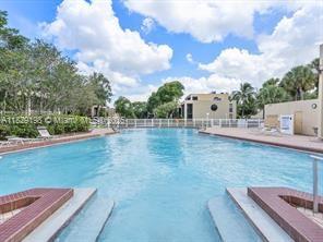 2941 Southwest 87th Avenue, Unit 406 Davie, FL 33328 - Photo 14 of 16 a view of a backyard with sitting area