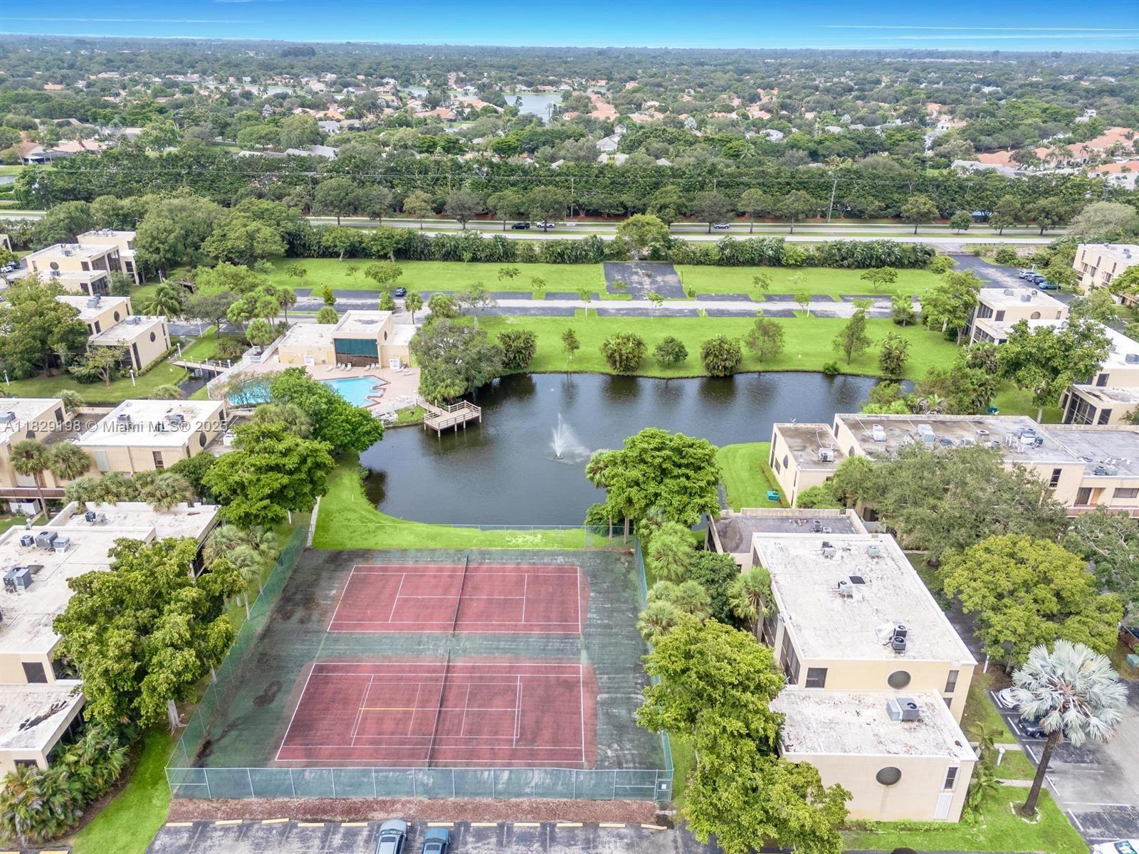 2941 Southwest 87th Avenue, Unit 406 Davie, FL 33328 - Photo 15 of 16 an aerial view of a house with a garden and lake view