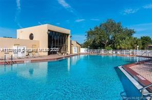 2941 Southwest 87th Avenue, Unit 406 Davie, FL 33328 - Photo 16 of 16 a view of a swimming pool with a patio