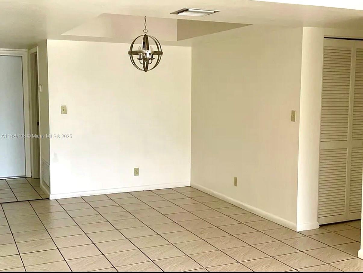 2941 Southwest 87th Avenue, Unit 406 Davie, FL 33328 - Photo 5 of 16 a view of a room with rack on the wall