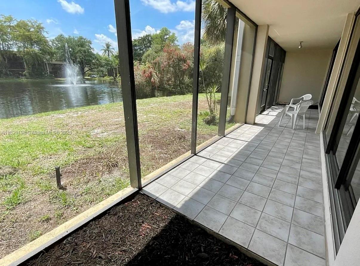 2941 Southwest 87th Avenue, Unit 406 Davie, FL 33328 - Photo 10 of 16 a view of swimming pool from a balcony
