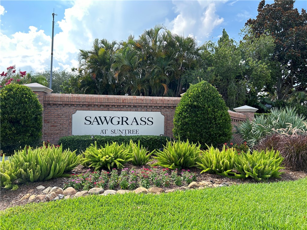 1723 Long Pine Road Melbourne, FL 32940 - Photo 3 of 31 a sign that is sitting in front of flowers