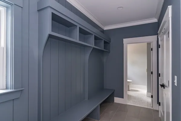a view of hallway with wooden floor and stairs