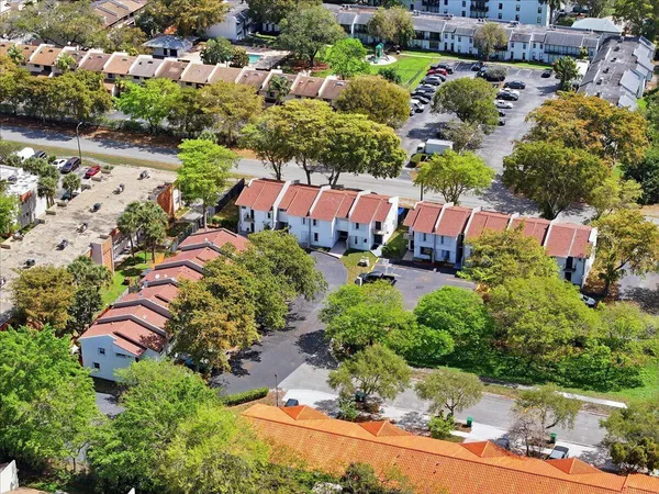 an aerial view of residential house with outdoor space and swimming pool