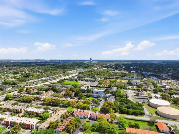 an aerial view of residential houses with outdoor space