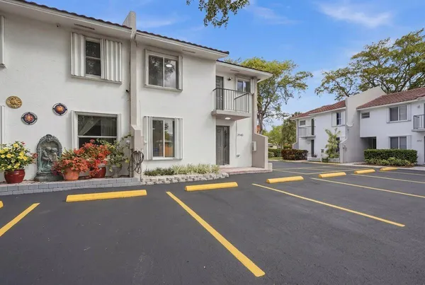 a front view of a house with yard and garage