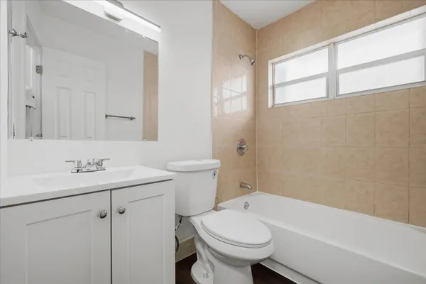 a bathroom with a sink toilet and vanity