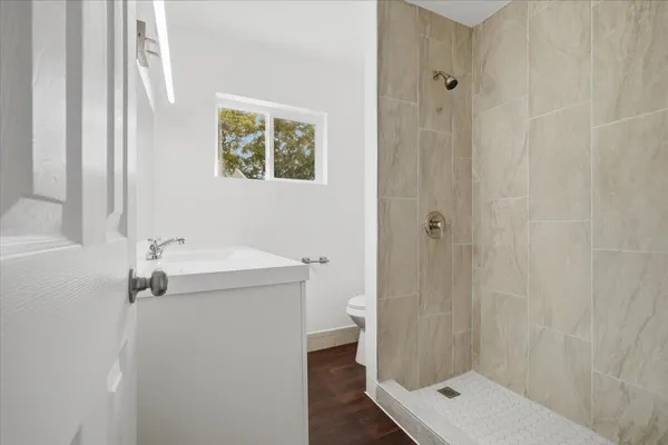 a bathroom with a shower and sink