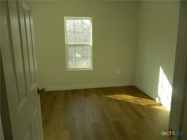 a view of an empty room and window