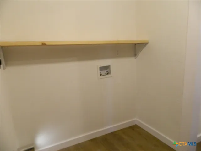 a view of small space with racks on the wall