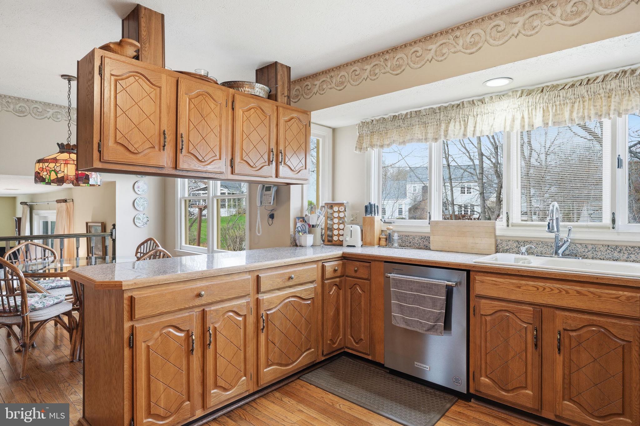 7 Wickham Court Sterling, VA 20165 - Photo 11 of 44 a kitchen with cabinets a sink and appliances