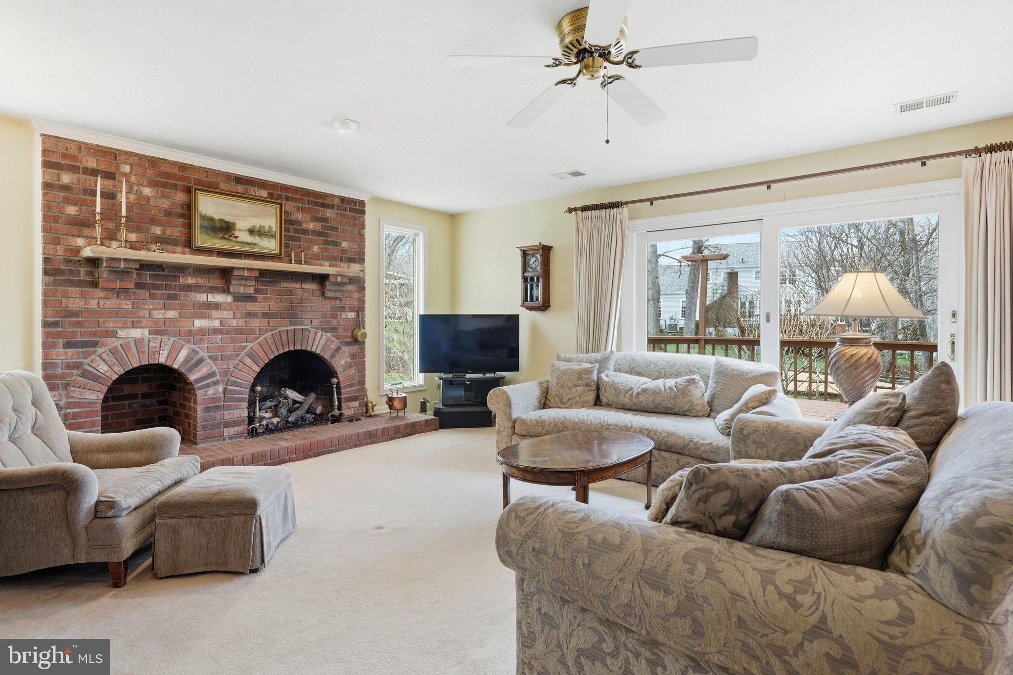 7 Wickham Court Sterling, VA 20165 - Photo 14 of 44 a living room with furniture and a fireplace