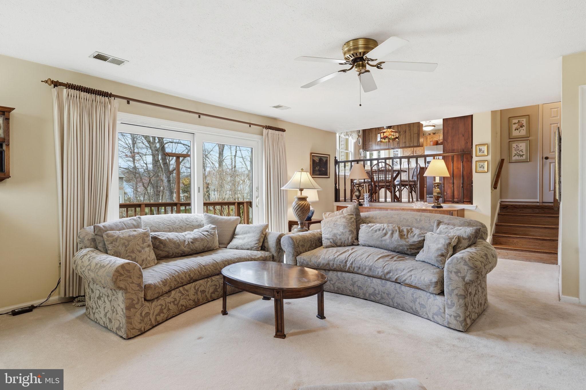 7 Wickham Court Sterling, VA 20165 - Photo 15 of 44 a living room with furniture and a large window