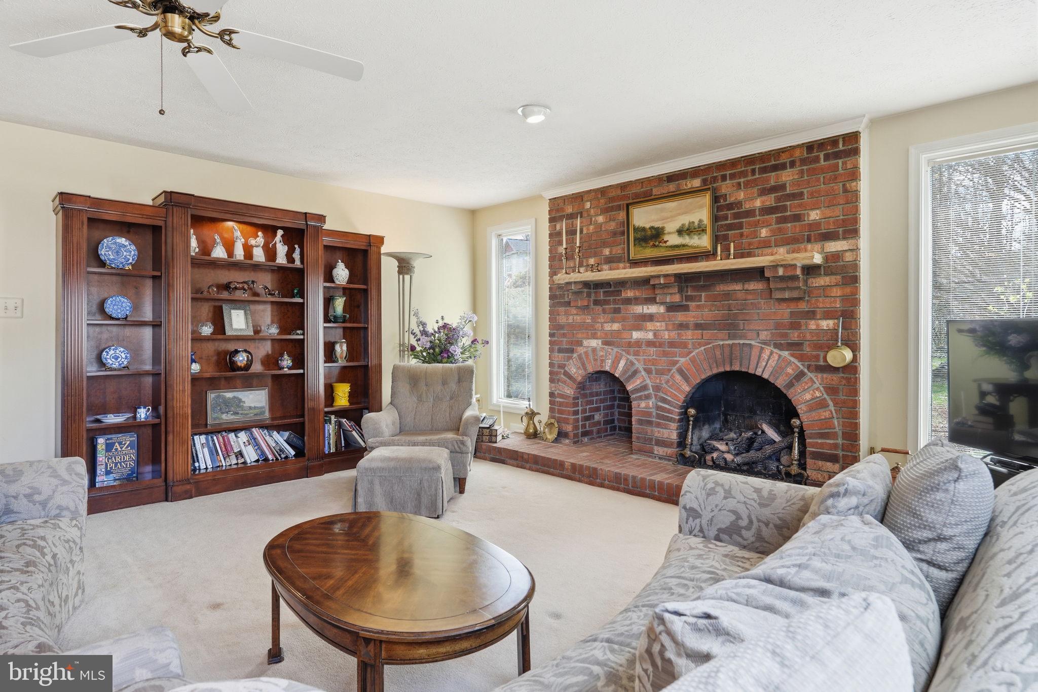 7 Wickham Court Sterling, VA 20165 - Photo 16 of 44 a living room with furniture and a fireplace