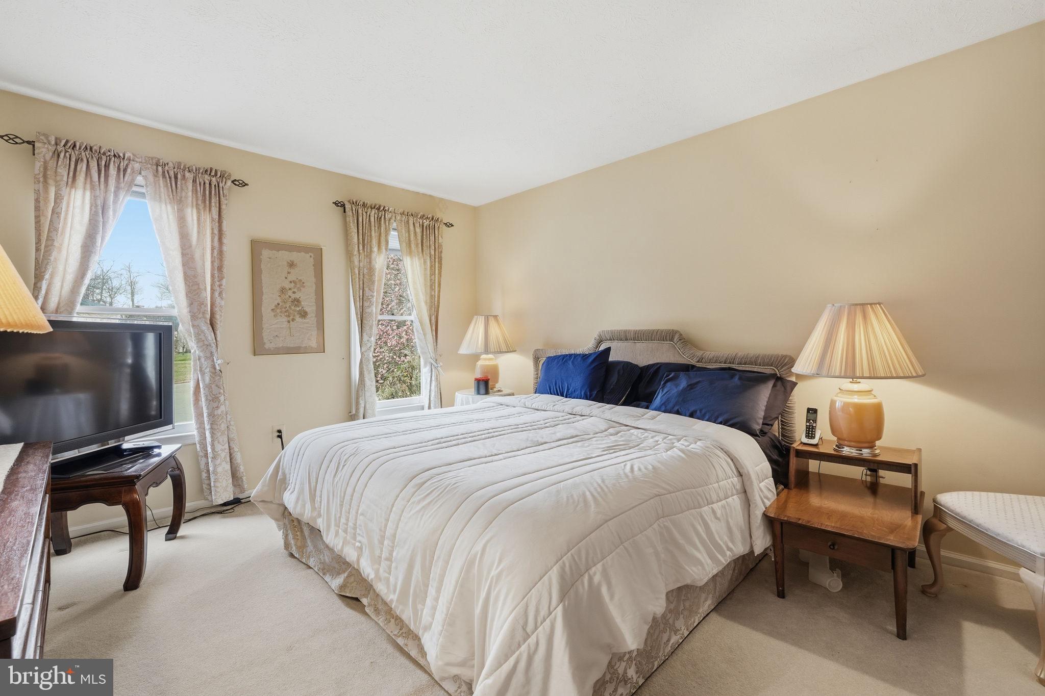 7 Wickham Court Sterling, VA 20165 - Photo 27 of 44 a bedroom with a bed and a window