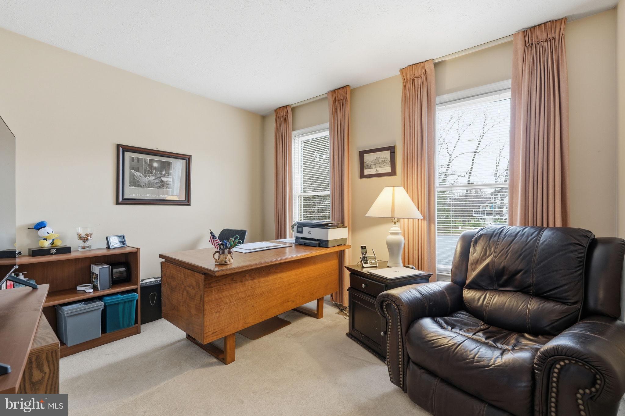 7 Wickham Court Sterling, VA 20165 - Photo 28 of 44 a living room with furniture and a large window