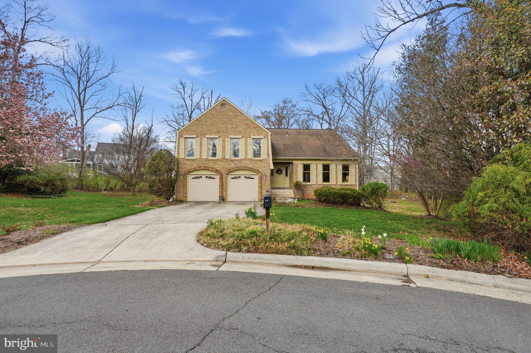 7 Wickham Court Sterling, VA 20165 - Photo 41 of 44 a front view of a house with a yard and garage