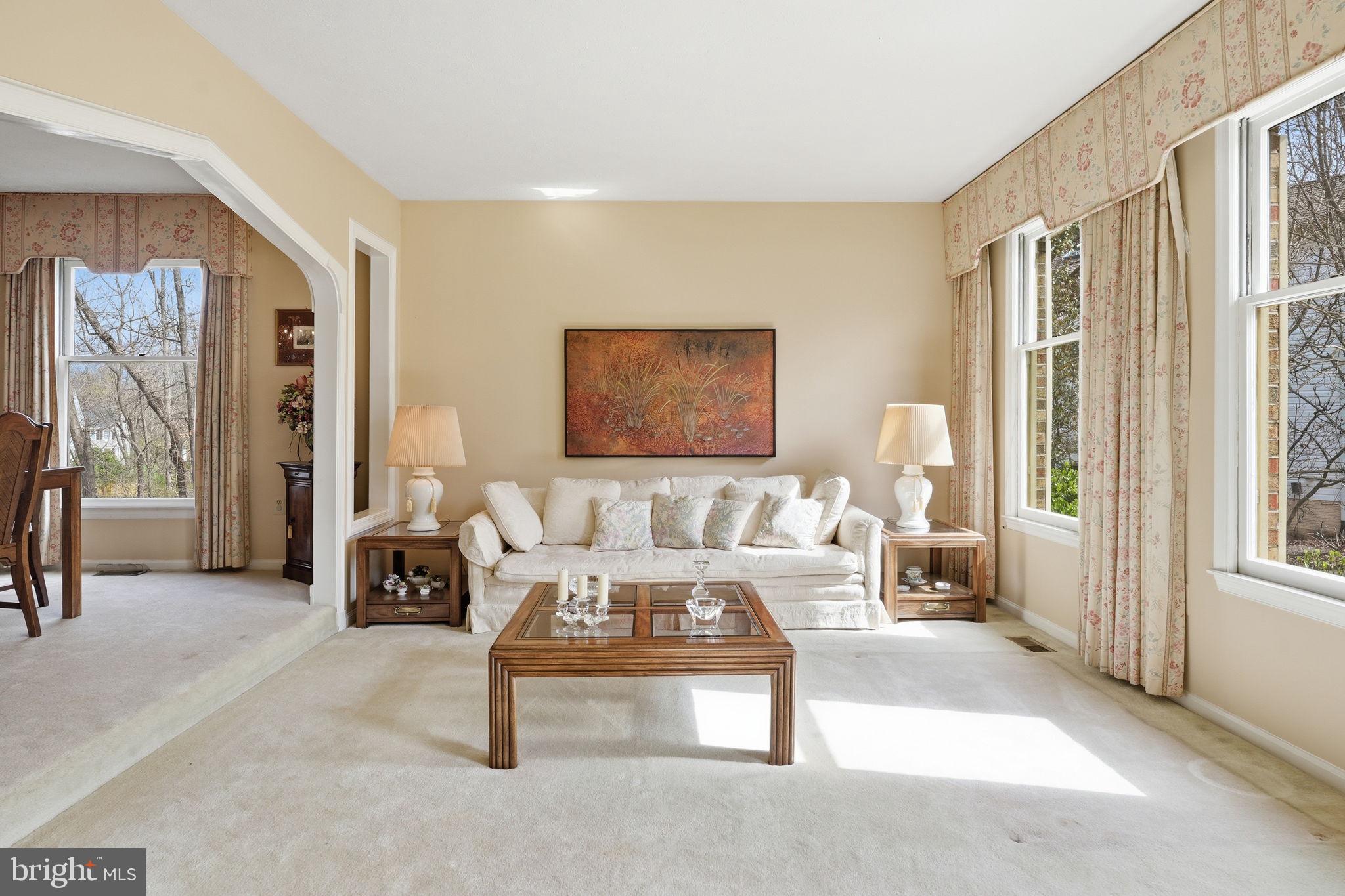 7 Wickham Court Sterling, VA 20165 - Photo 6 of 44 a living room with furniture a large window and a table