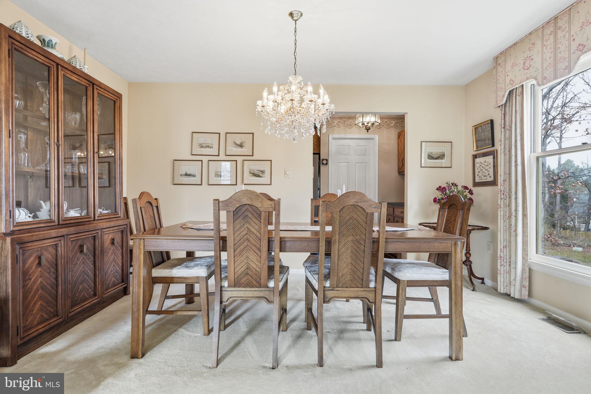 7 Wickham Court Sterling, VA 20165 - Photo 9 of 44 a dining room with furniture a chandelier and window