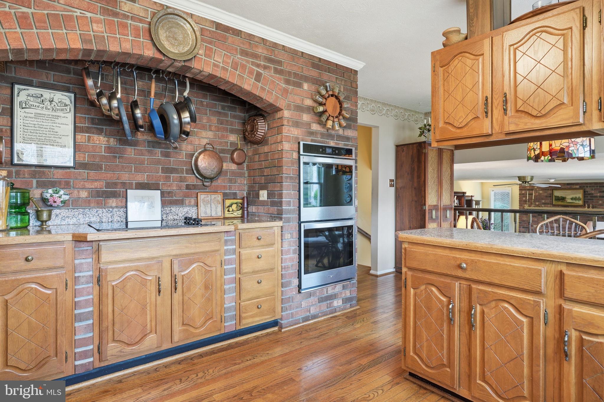 7 Wickham Court Sterling, VA 20165 - Photo 10 of 44 a kitchen with wooden cabinets and a stove
