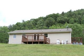 2575 Split Rail Road Shawsville, VA 24162 - Photo 3 of 25 a backyard of a house with table and chairs
