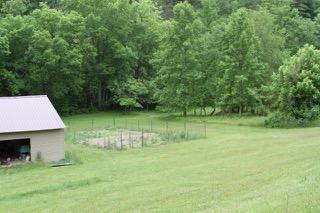 2575 Split Rail Road Shawsville, VA 24162 - Photo 21 of 25 a view of a garden with a bench