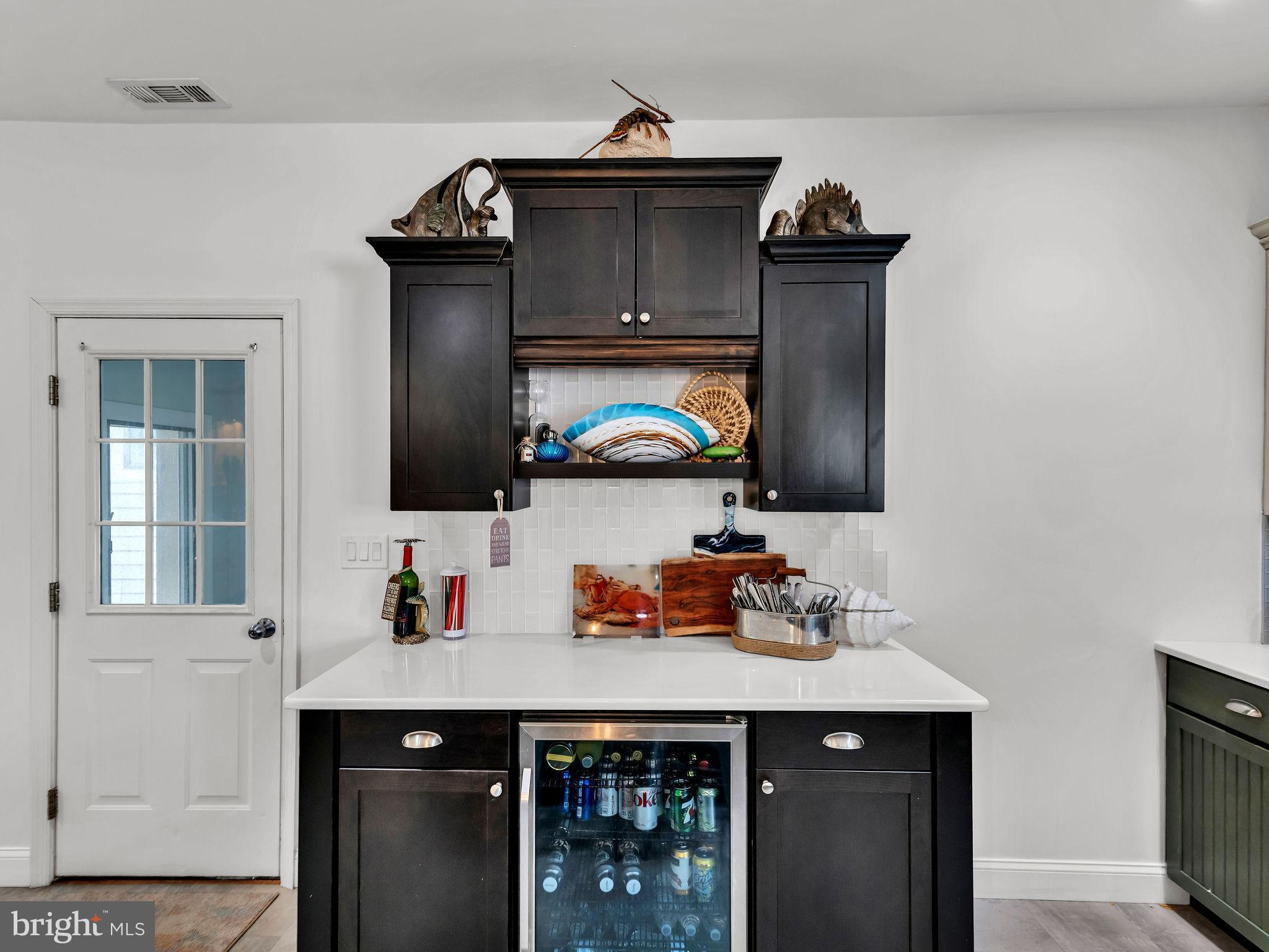 12608 Selsey Road Ocean City, MD 21842 - Photo 18 of 66 a kitchen with a sink and cabinets